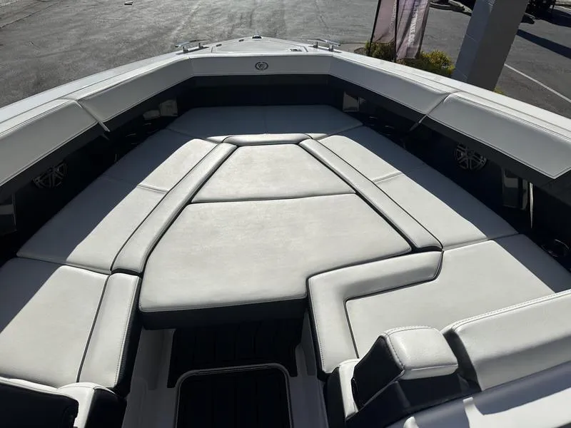 Slide: The Image of 2023 Cobalt R33 boat interior with luxurious white seating and modern design. - 43