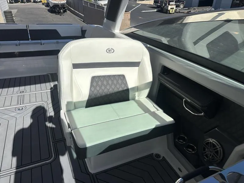 Slide: The Image of 2023 Cobalt R33 boat interior with white and gray seating, modern design. - 45