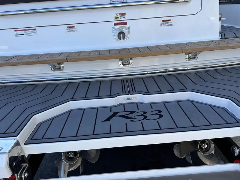 Slide: The Image of 2023 Cobalt R33 boat deck with sleek design and modern features. - 8