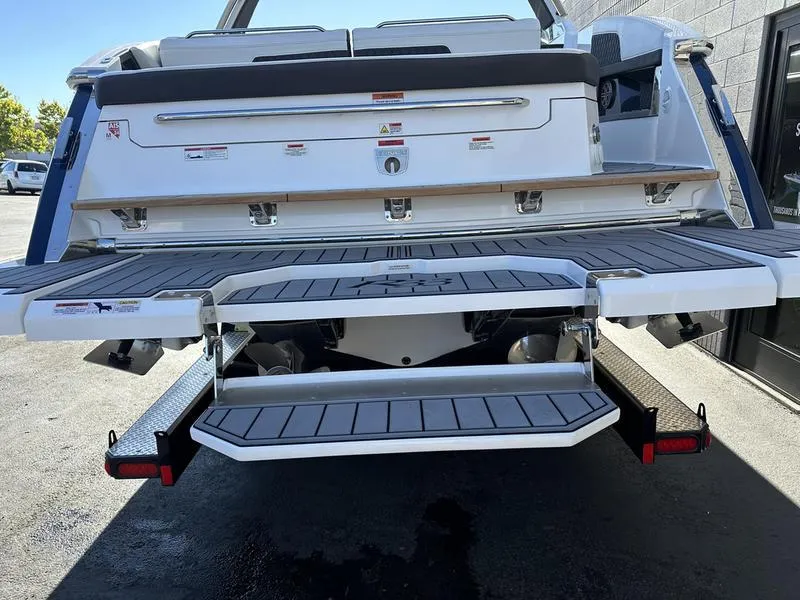 Slide: The Image of 2023 Cobalt R33 boat with extended swim platform and sleek design. - 9