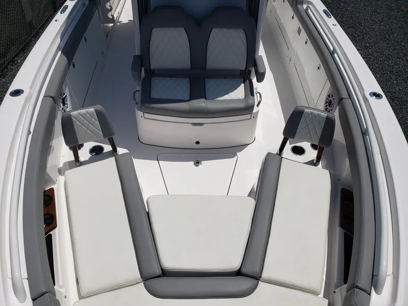 Slide: The Image of 2023 Everglades 285CC boat interior with cushioned seating and sleek design. - 18