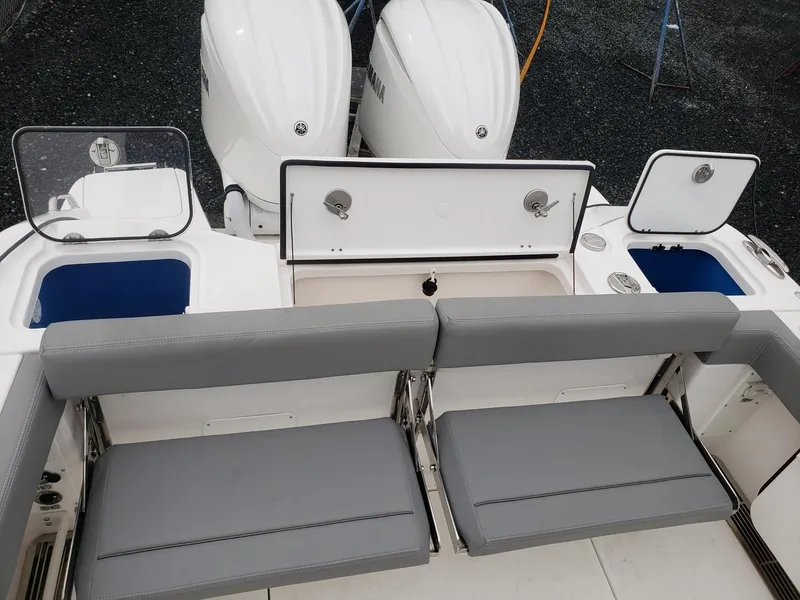 Slide: The Image of 2023 Everglades 285CC boat with dual engines and gray seating. - 26