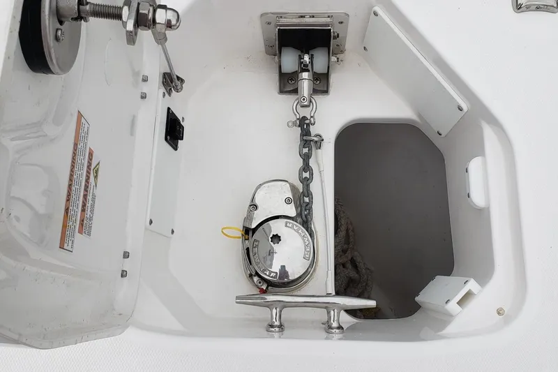 Slide: The Image of Anchor compartment of 2023 Everglades 285CC boat with chain and cleat. - 30