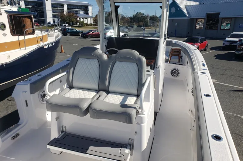 Slide: The Image of 2023 Everglades 285CC boat interior with dual seats and modern design. - 31