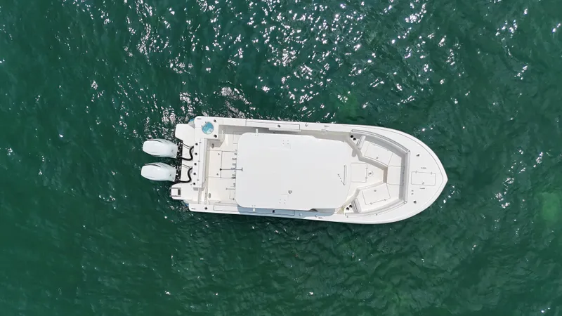 Slide: The Image of Aerial view of 2024 Sea Born SX281 Offshore LE boat on water. - 16