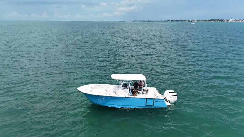 Slide: The Image of 2024 Sea Born SX281 Offshore LE boat cruising on open water. - 3