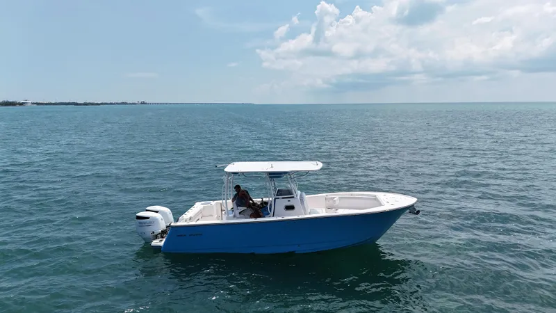 Slide: The Image of 2024 Sea Born SX281 Offshore LE boat cruising on open water. - 8