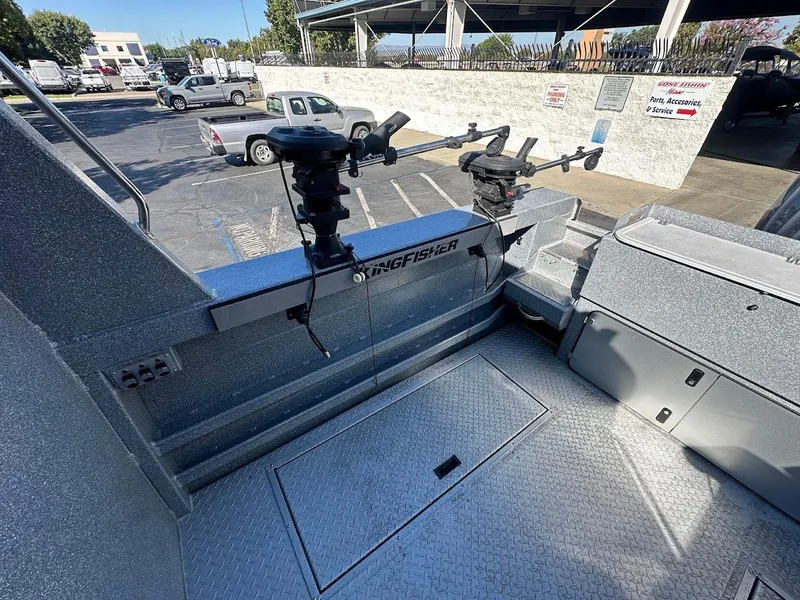 Slide: The Image of 2025 KingFisher 2225 Escape HT boat interior with fishing rod holders. - 17