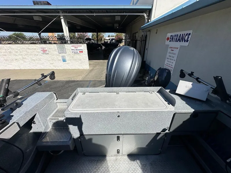 Slide: The Image of 2025 KingFisher 2225 Escape HT boat interior with fishing equipment and storage compartments. - 19
