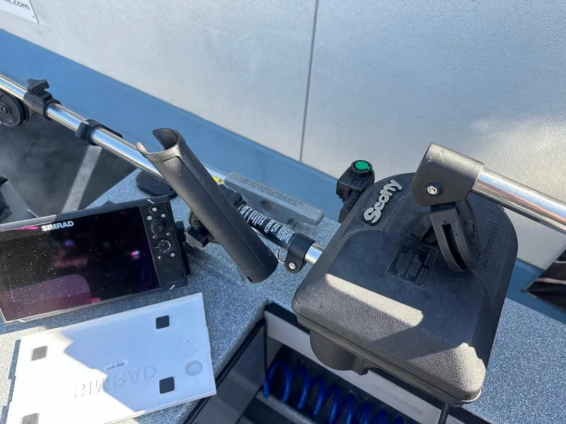 Slide: The Image of Fishing rod holder and Simrad display on 2025 KingFisher 2225 Escape HT boat. - 22