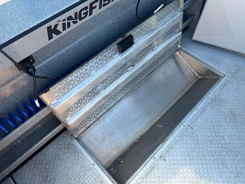 Slide: The Image of Open storage compartment on 2025 KingFisher 2225 Escape HT boat. - 25