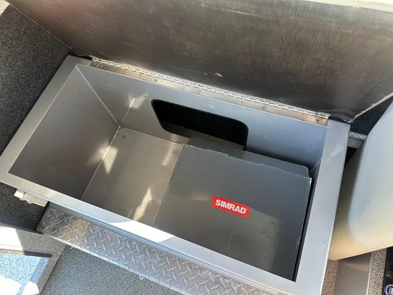 Slide: The Image of Open storage compartment in 2025 KingFisher 2225 Escape HT boat with Simrad equipment. - 33