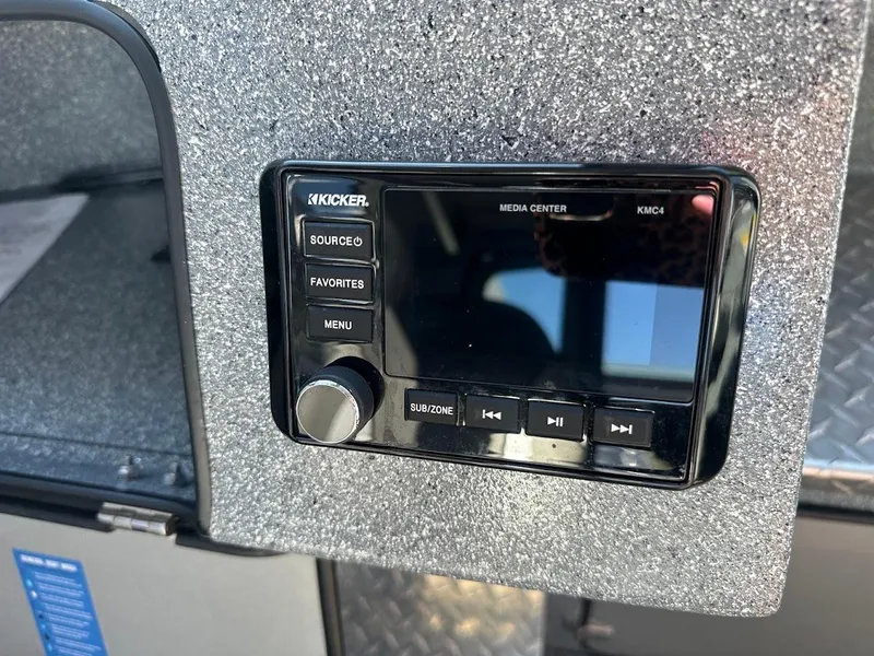 Slide: The Image of Kicker media center in 2025 KingFisher 2225 Escape HT boat, featuring control buttons. - 36