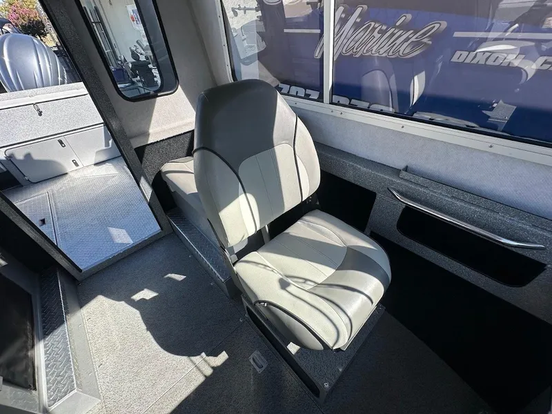 Slide: The Image of Interior of 2025 KingFisher 2225 Escape HT boat, featuring a comfortable seat and modern design. - 38