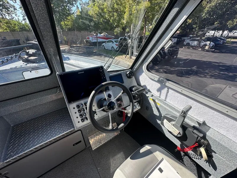 Slide: The Image of Interior of 2025 KingFisher 2225 Escape HT boat showing steering and controls. - 40