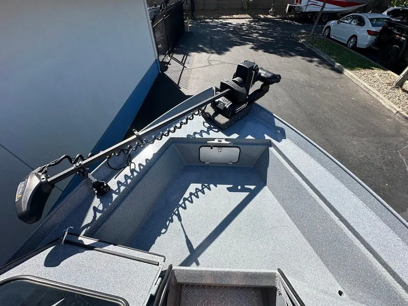 Slide: The Image of 2025 KingFisher 2225 Escape HT boat deck with mounted trolling motor. - 46