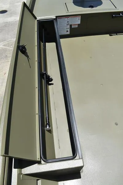 Slide: The Image of 2025 Lowe RX1860 RAMBLER boat storage compartment with fishing rod. - 10
