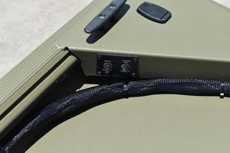 Slide: The Image of Control panel on 2025 Lowe RX1860 RAMBLER boat, featuring switches and wiring. - 14