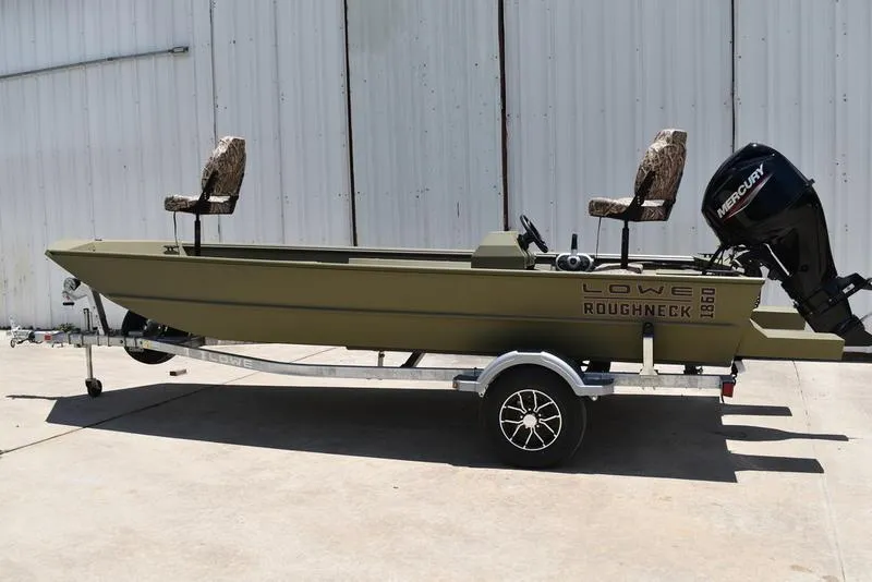 Slide: The Image of 2025 Lowe RX1860 RAMBLER boat on trailer, featuring camo seats and Mercury outboard motor. - 3