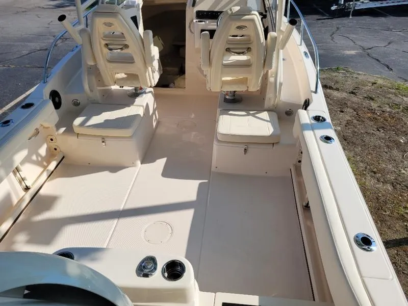 Slide: The Image of 2025 Grady-White Adventure 218 boat interior with seating and console. - 13