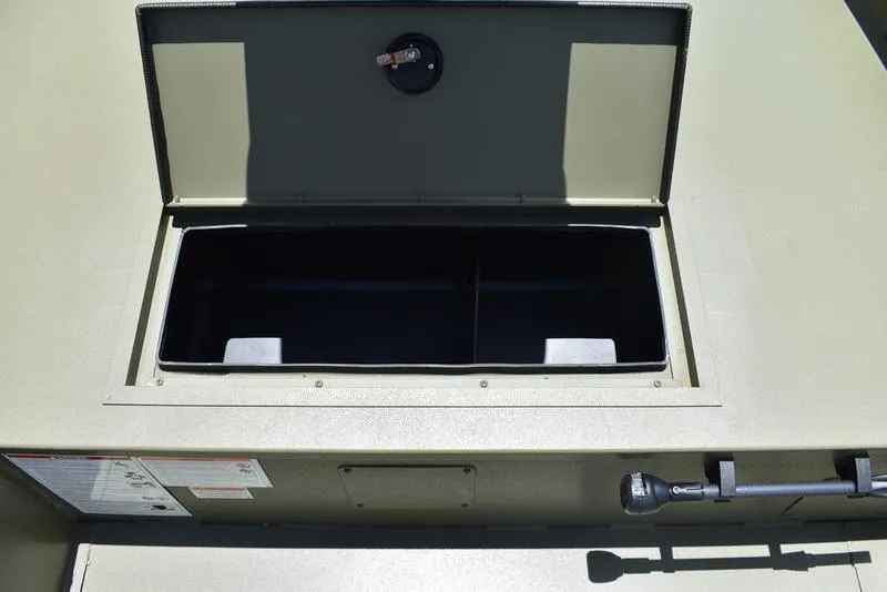 Slide: The Image of Open storage compartment of 2025 Lowe RX1860 RAMBLER boat, showcasing interior space. - 13