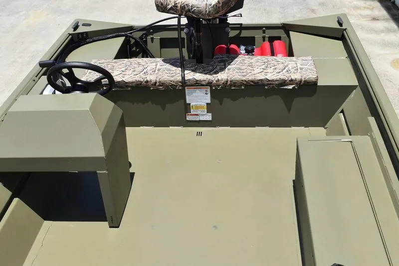 Slide: The Image of 2025 Lowe RX1860 RAMBLER boat interior with camouflage seating and steering wheel. - 17