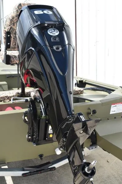 Slide: The Image of 2025 Lowe RX1860 RAMBLER boat with powerful black outboard motor. - 6
