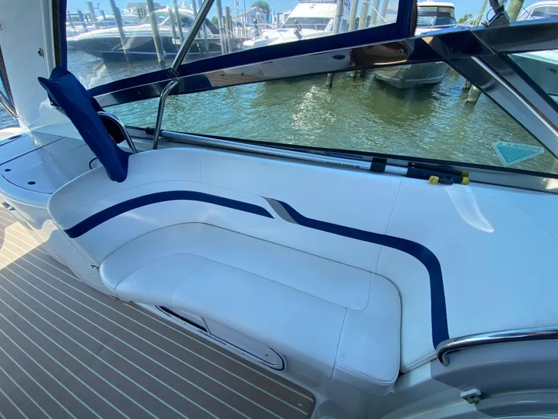 Slide: The Image of 2004 Formula 370 Super Sport boat interior with white and blue seating. - 10
