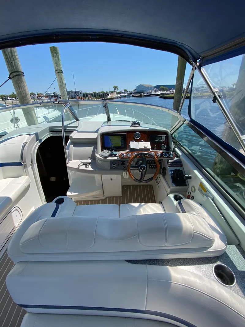 Slide: The Image of 2004 Formula 370 Super Sport boat cockpit with modern navigation equipment. - 11