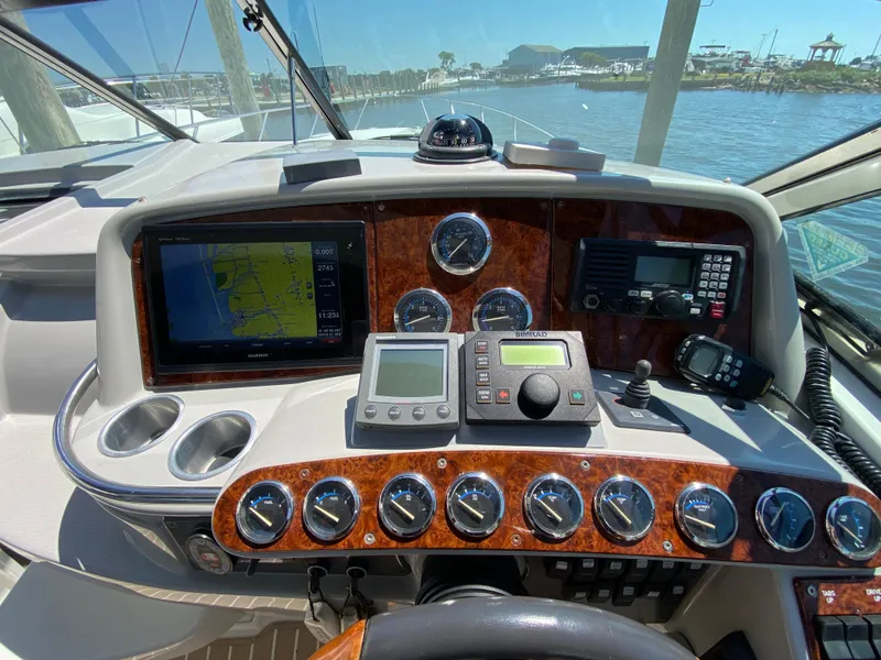 Slide: The Image of Dashboard of a 2004 Formula 370 Super Sport boat with navigation and control instruments. - 13