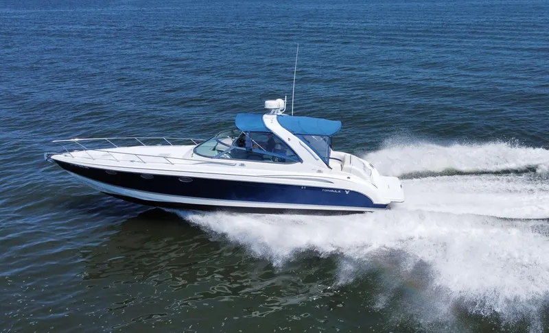 Slide: The Image of 2004 Formula 370 Super Sport speedboat cruising on open water. - 2