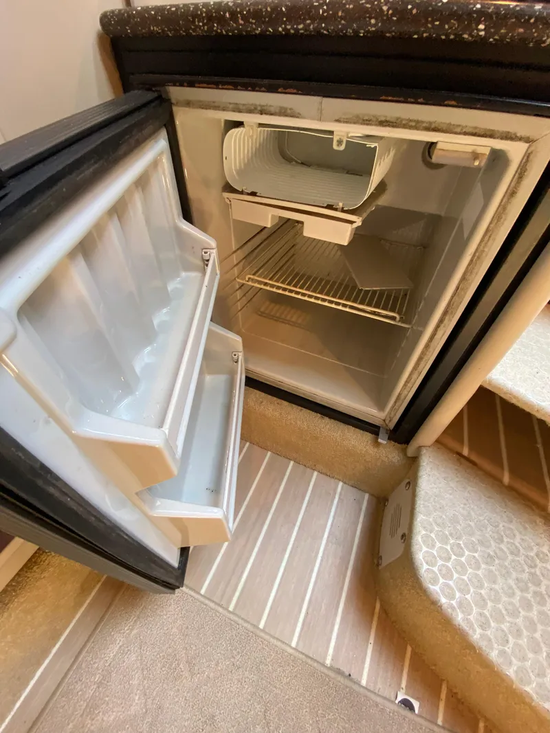 Slide: The Image of Open refrigerator inside a 2004 Formula 370 Super Sport boat. - 20