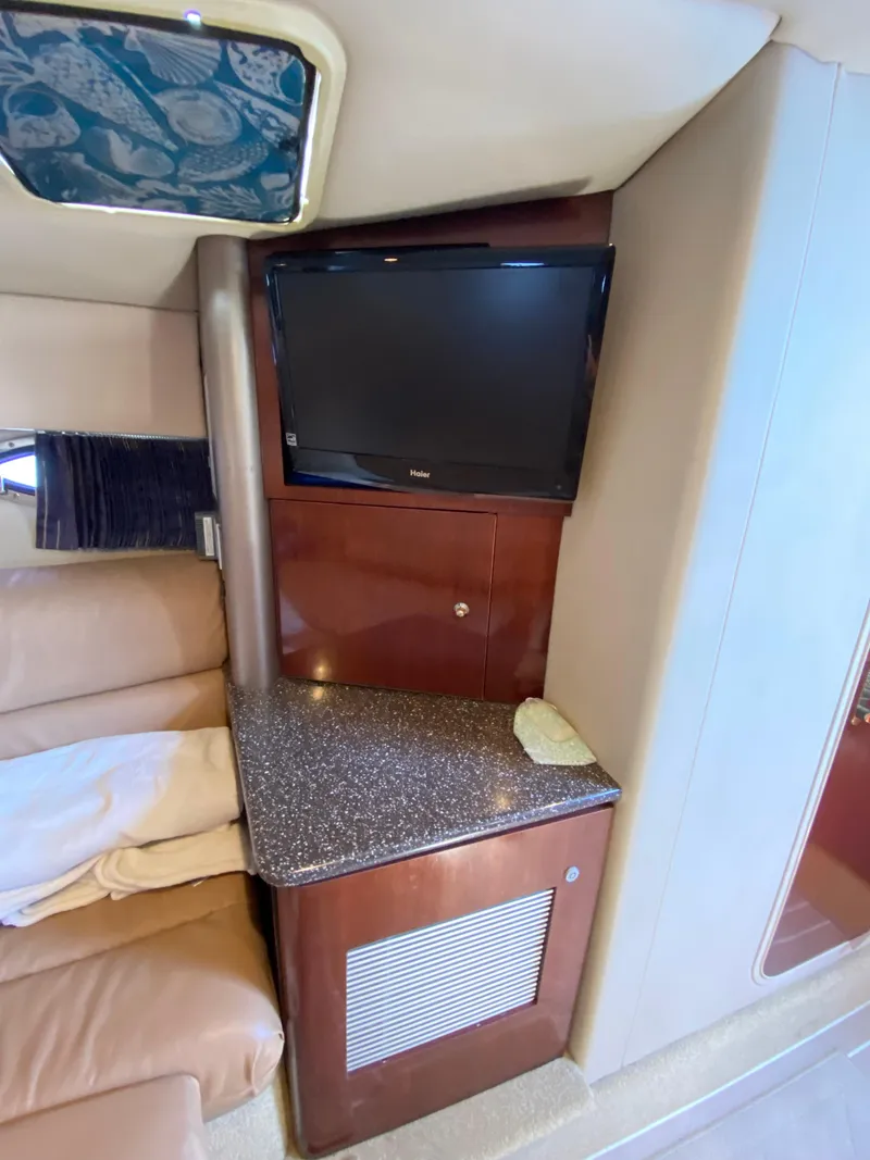 Slide: The Image of Interior of 2004 Formula 370 Super Sport with TV and countertop. - 23