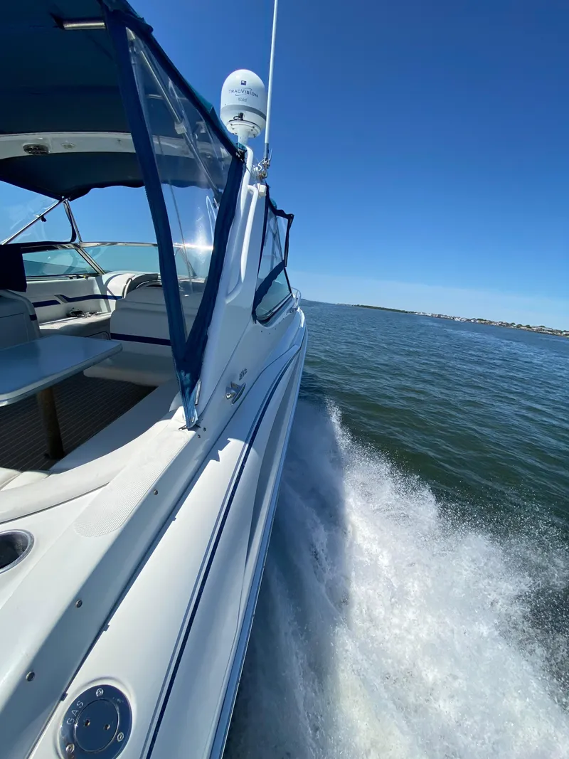 Slide: The Image of 2004 Formula 370 Super Sport cruising on open water. - 4