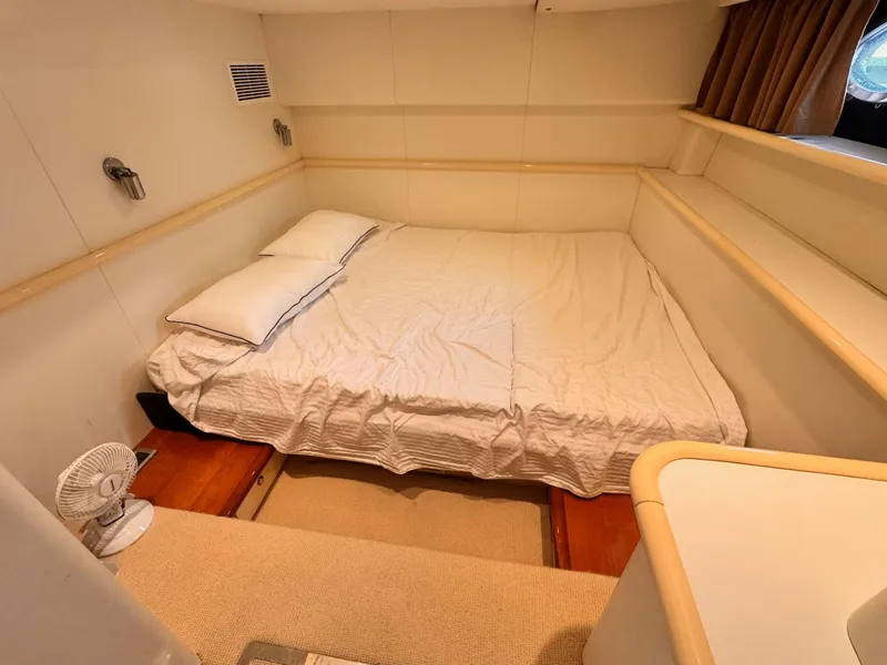 Slide: The Image of Cozy bedroom in 1995 Sunseeker MANHATTAN yacht with double bed and soft lighting. - 10