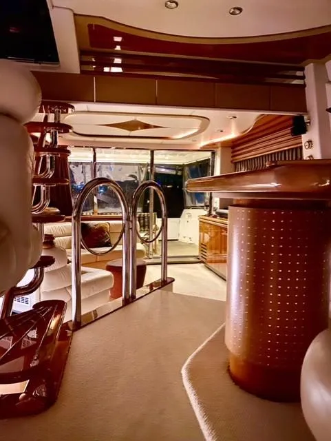 Slide: The Image of Luxurious interior of a 1995 Sunseeker MANHATTAN yacht with elegant furnishings and ambient lighting. - 11