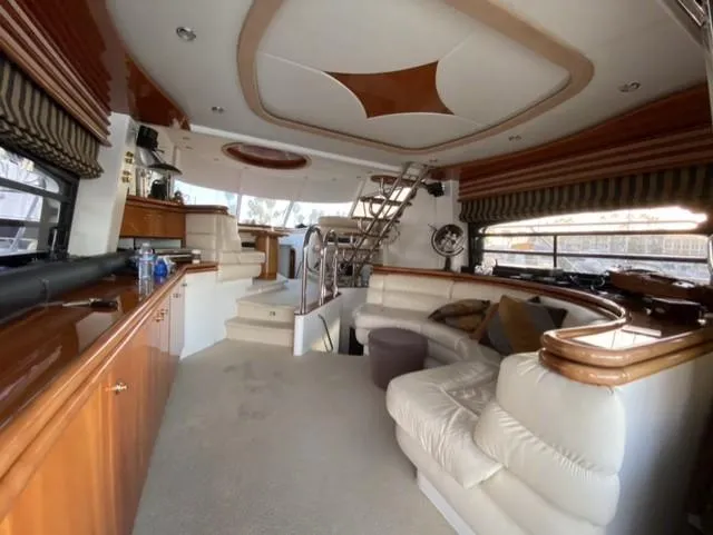 Slide: The Image of Luxurious interior of a 1995 Sunseeker Manhattan yacht with elegant seating and modern design. - 12