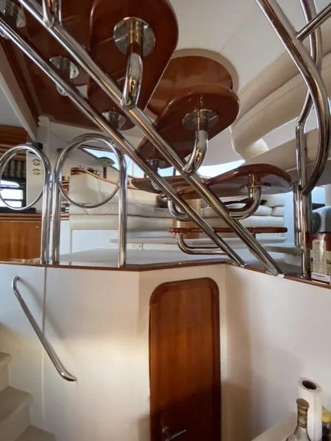 Slide: The Image of Interior view of 1995 Sunseeker MANHATTAN yacht with elegant wood and metal staircase. - 14
