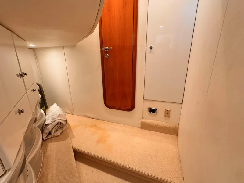 Slide: The Image of Interior of 1995 Sunseeker MANHATTAN yacht with wooden door and carpeted floor. - 17