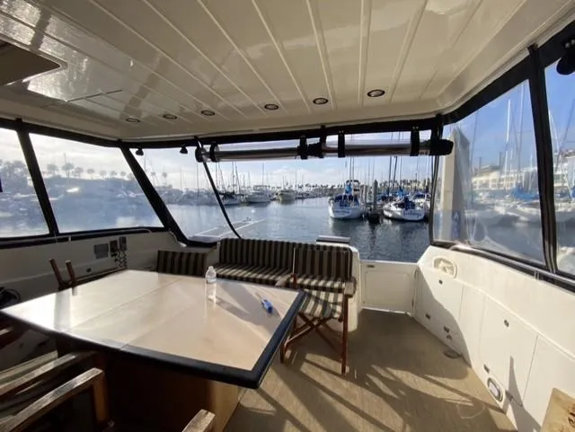 Slide: The Image of Interior view of 1995 Sunseeker MANHATTAN yacht with marina backdrop. - 24