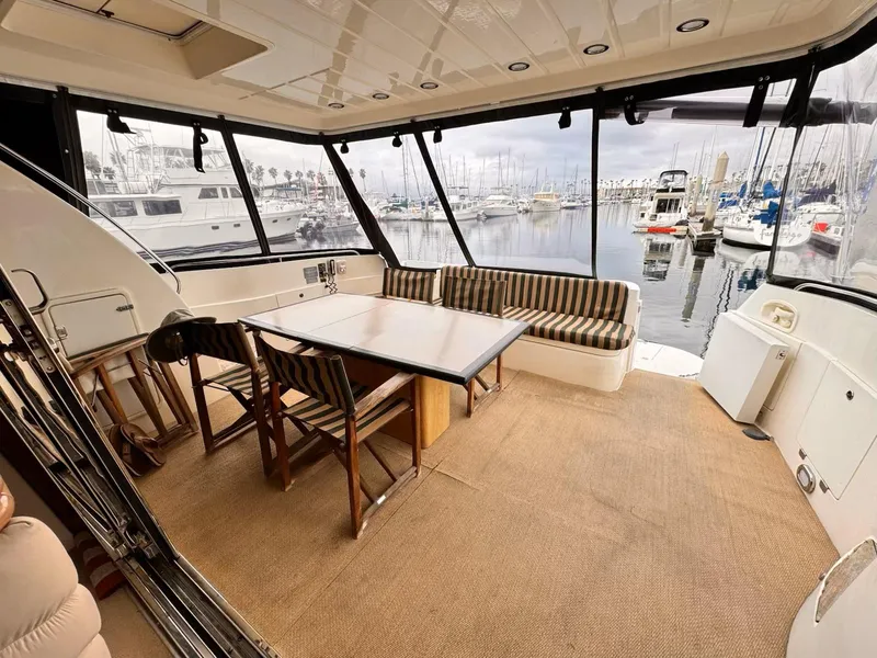 Slide: The Image of Sunseeker MANHATTAN 1995 yacht interior with dining area overlooking marina. - 25