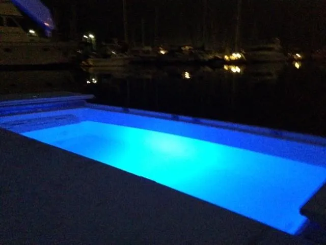 Slide: The Image of Illuminated pool on a 1995 Sunseeker MANHATTAN yacht at night. - 26