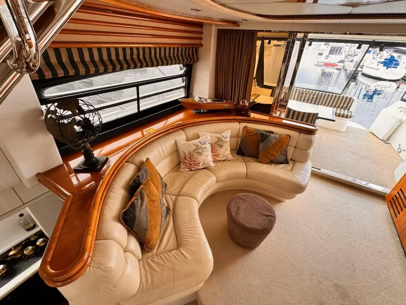 Slide: The Image of Luxurious 1995 Sunseeker MANHATTAN yacht interior with plush seating and elegant decor. - 3