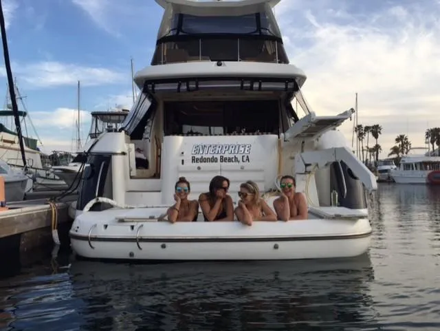 Slide: The Image of Four people relaxing on a Sunseeker MANHATTAN yacht, Redondo Beach marina, 1995 model. - 30