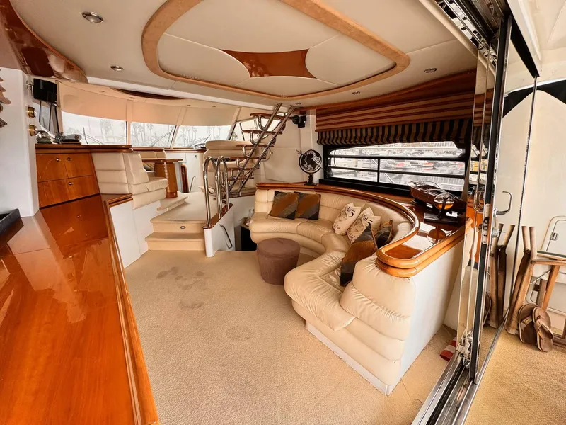 Slide: The Image of Luxurious 1995 Sunseeker MANHATTAN yacht interior with elegant seating and wooden accents. - 4