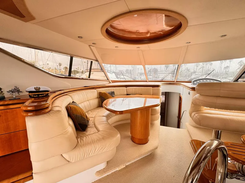 Slide: The Image of Luxurious interior of a 1995 Sunseeker MANHATTAN yacht with elegant seating and wooden accents. - 6