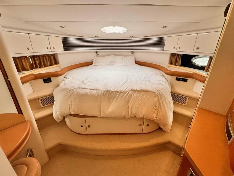 Slide: The Image of Luxurious bedroom interior of 1995 Sunseeker MANHATTAN yacht with cozy bed and elegant design. - 7