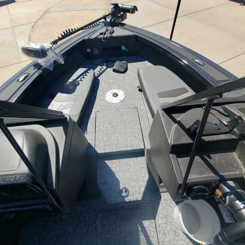 Slide: The Image of 2024 Tracker Targa V-19 Combo boat interior with seating and equipment. - 2