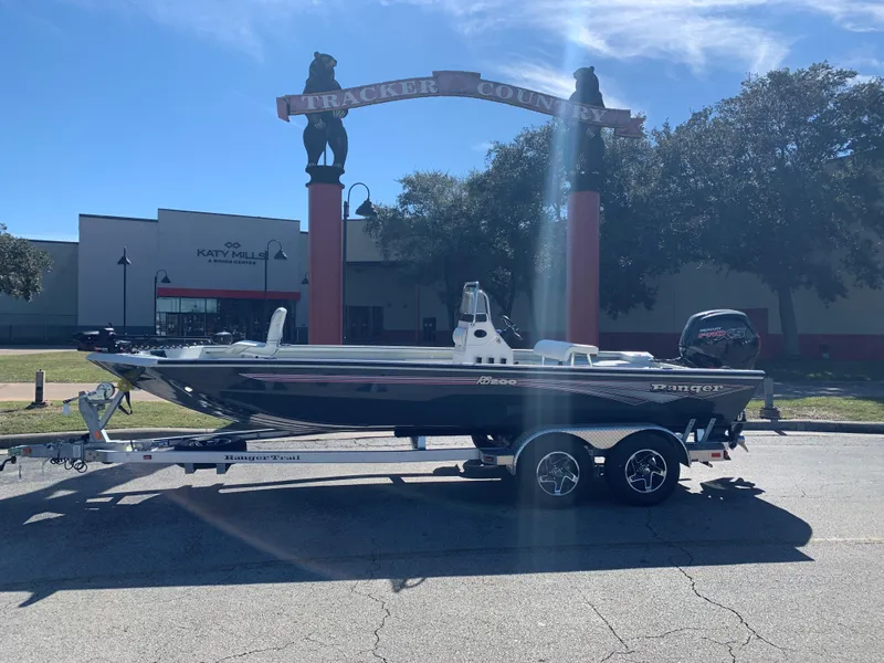 Slide: The Image of 2024 Ranger RB200 boat on trailer in sunny outdoor setting. - 0