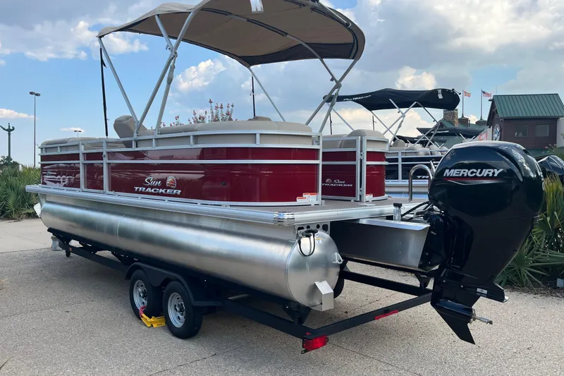 Slide: The Image of 2024 Sun Tracker Party Barge 24 DLX pontoon boat with Mercury outboard motor. - 3